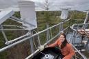 UNH graduate student Desneiges (Deni) Murray at the nitrogen collection site on UNH’s Thompson Farm in Durham, NH.